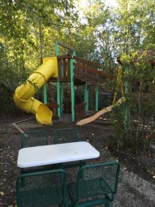 camping activities for kids include playground featuring circular slide