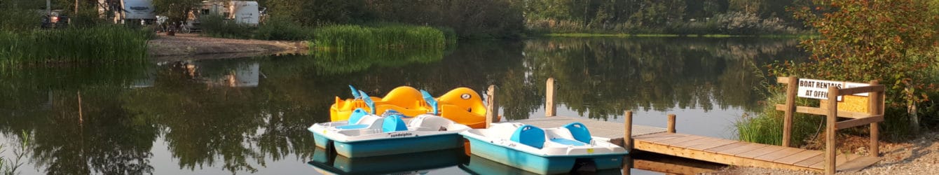 Paddle boats on pond at Riverbend Campground available for rent